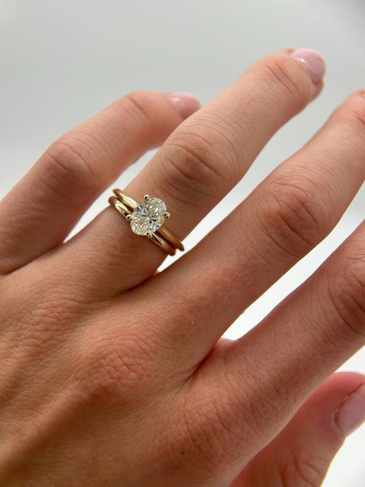 Oval Solitaire ring and simple gold band