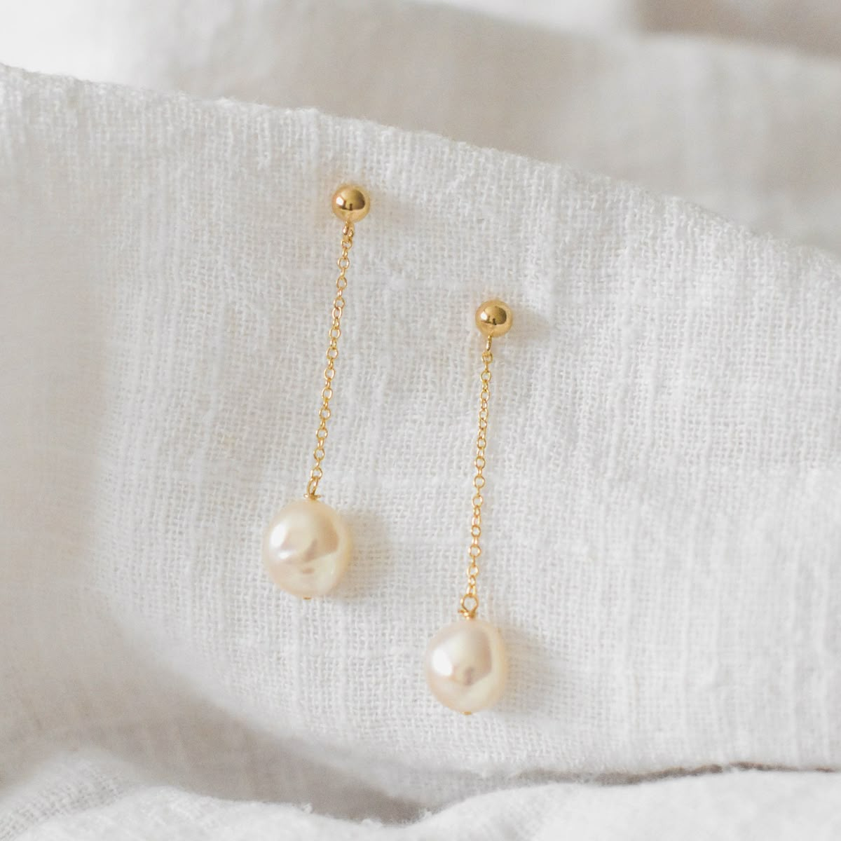 drop earrings with a pearl