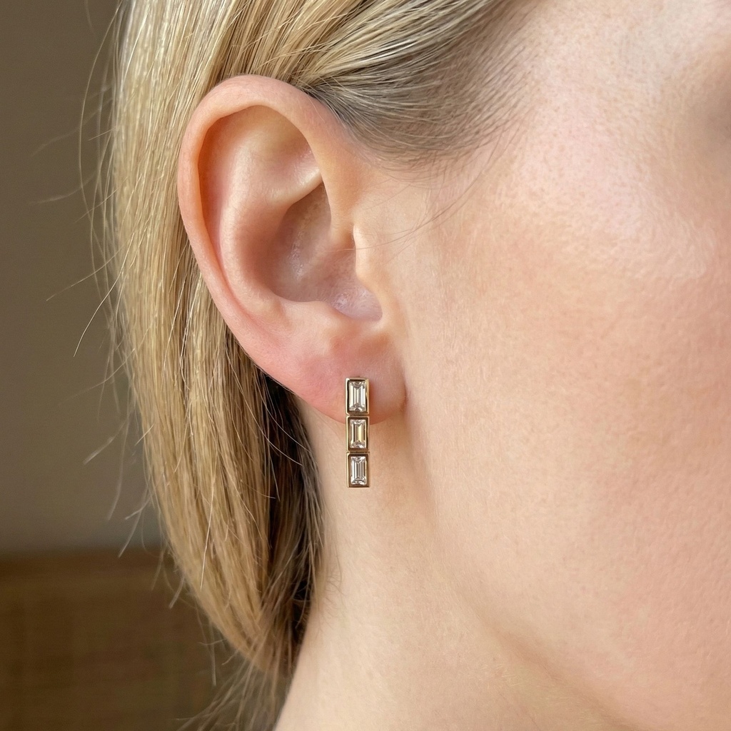 14K Rose Gold Prism Drop Earrings worn on a model's ear to show the elegant drop length